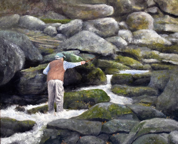 Man fishing among river rocks in thd Smoky Mountains