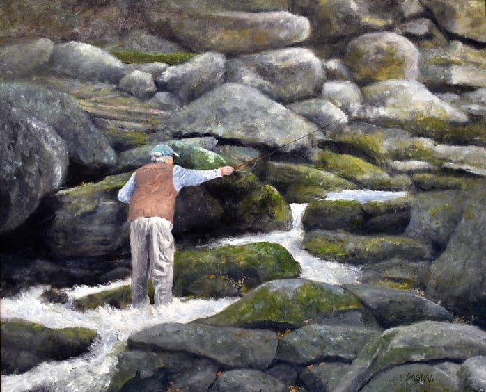 Man fishing among river rocks in thd Smoky Mountains